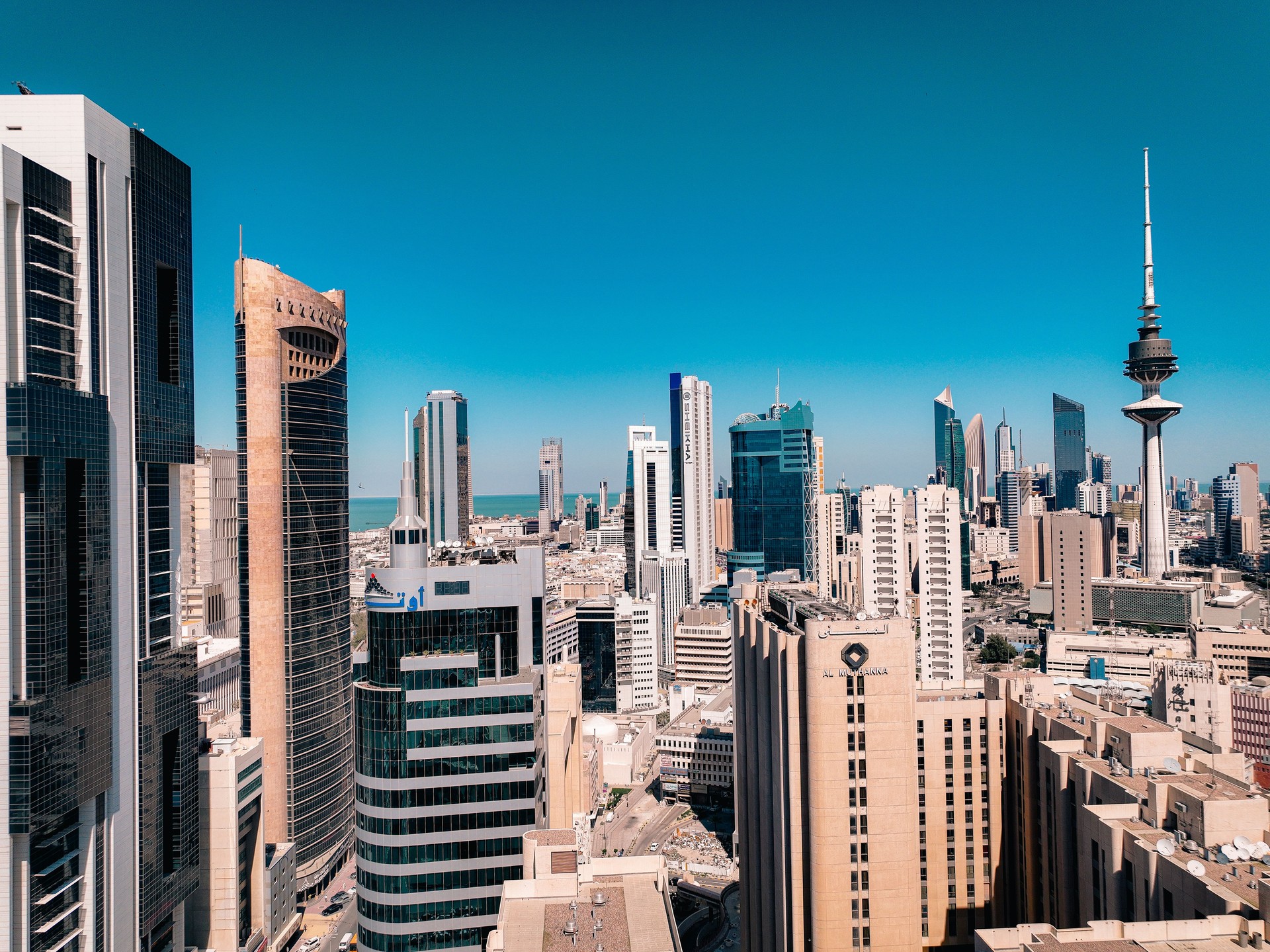 An aerial photo of the towers and skyscrapers in Kuwait City at noon